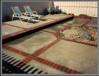 concrete patio with brick inlay construction