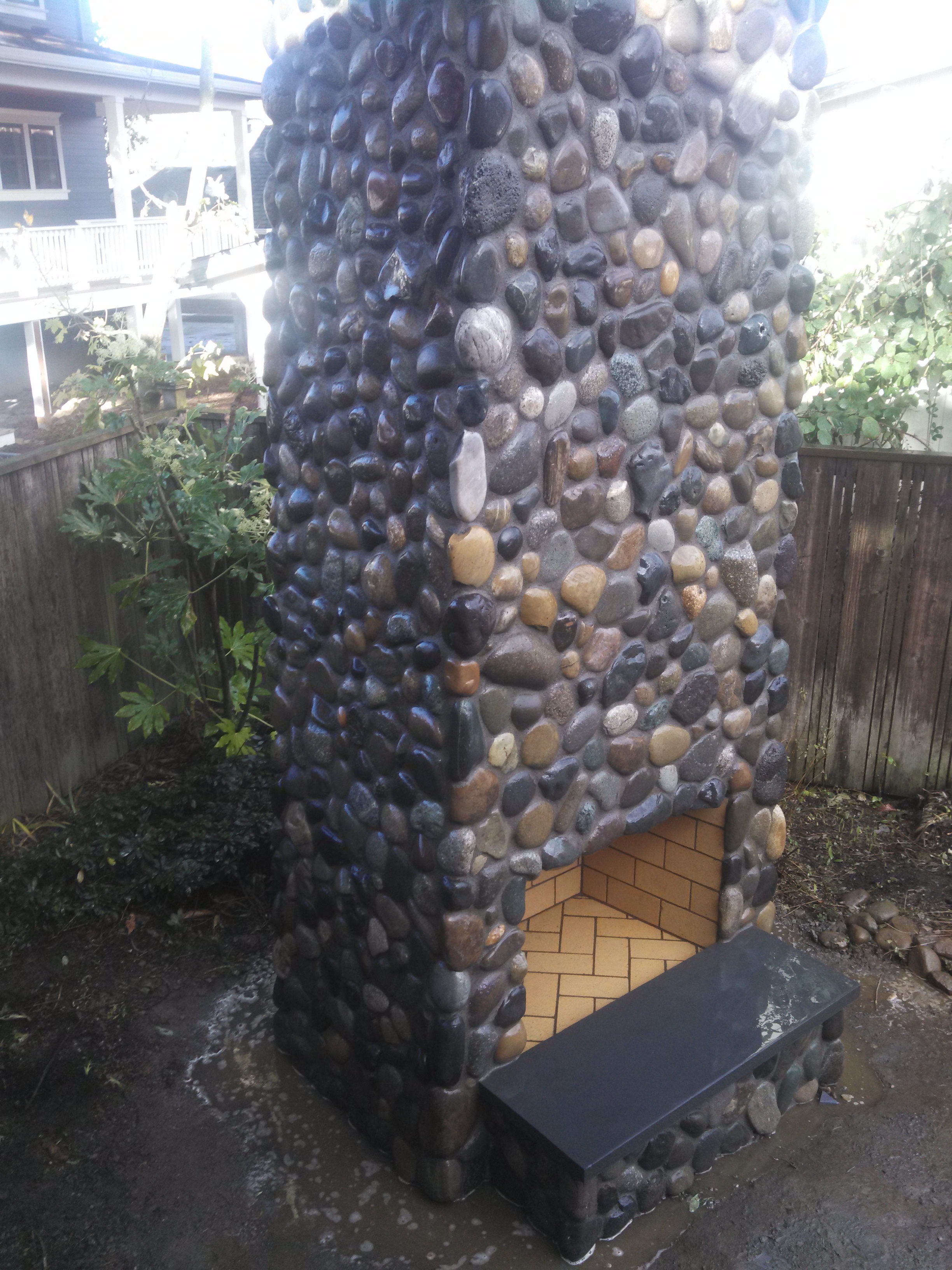 fireplace build in river rock stone